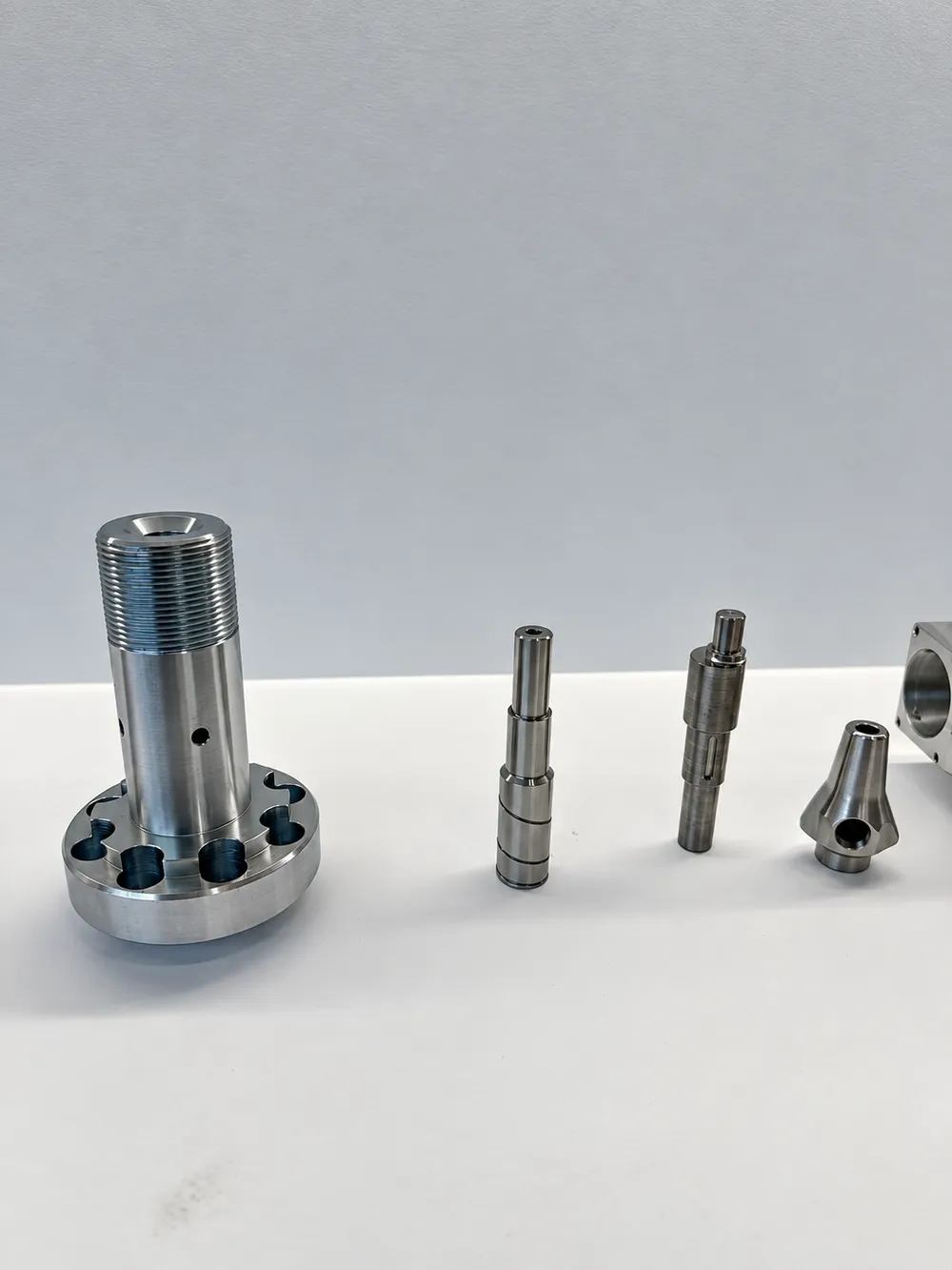 Precision CNC turned shafts and machined metal bushings