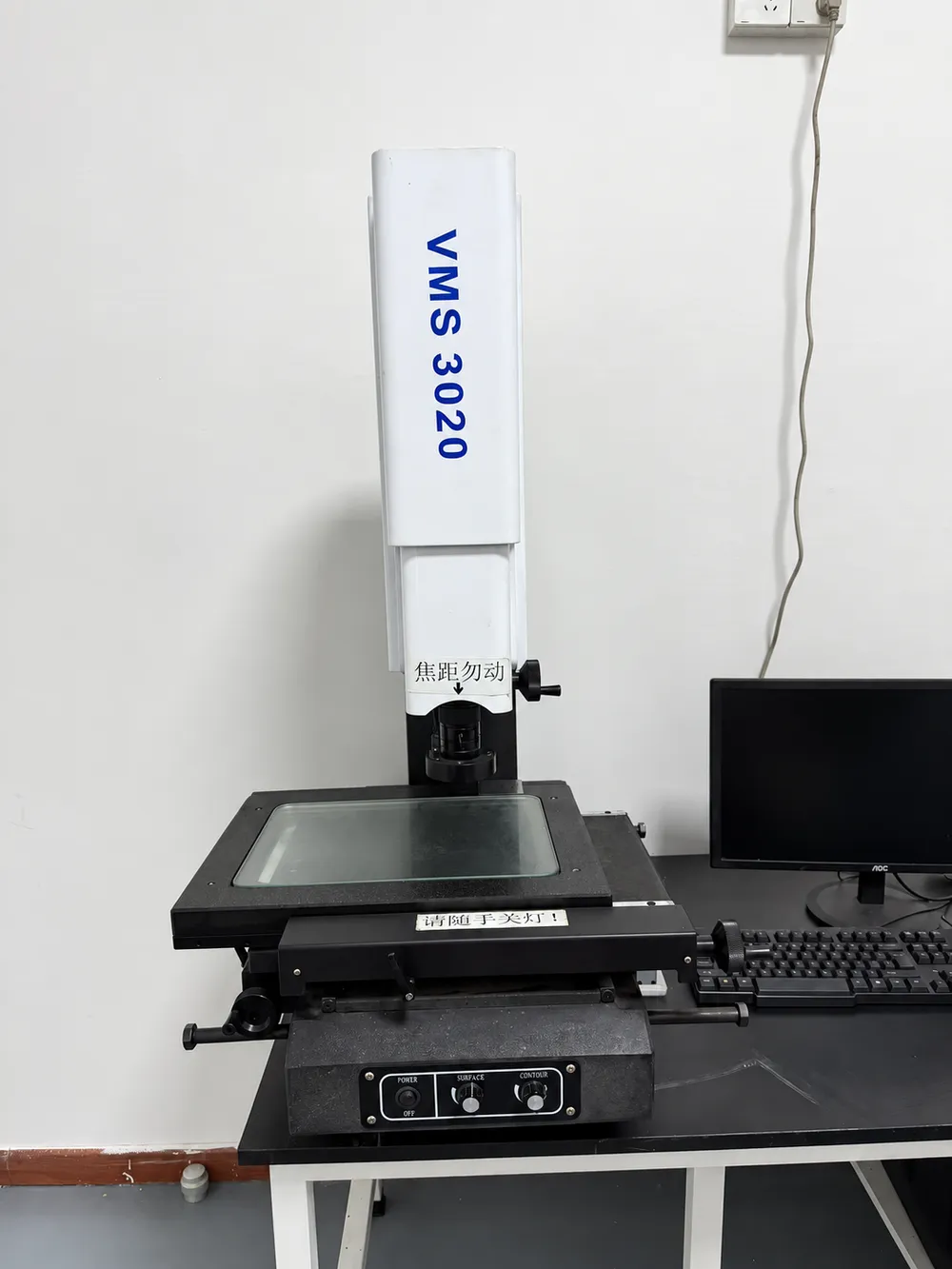 Optical measuring system for dimensional inspection of CNC components