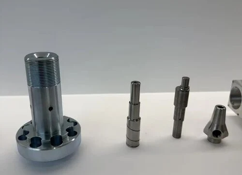 Precision CNC turned shafts and machined metal bushings