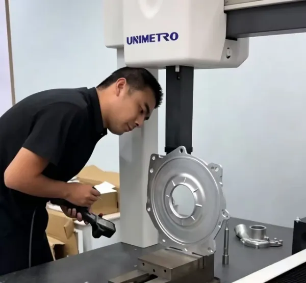YCS inspector checking a CNC machined component with measurement equipment