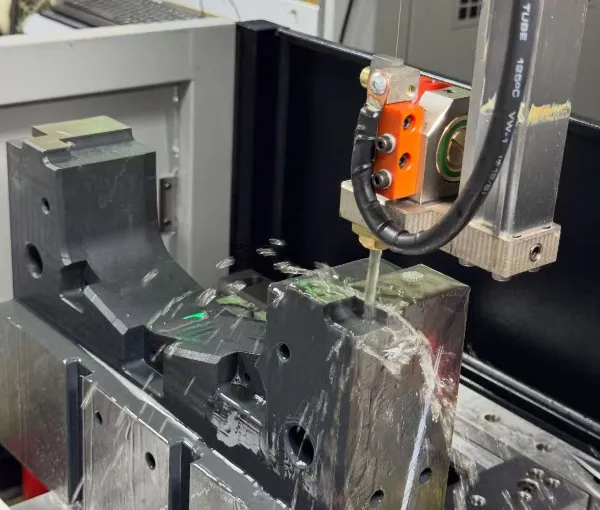 Wire EDM machining process for a precision metal component